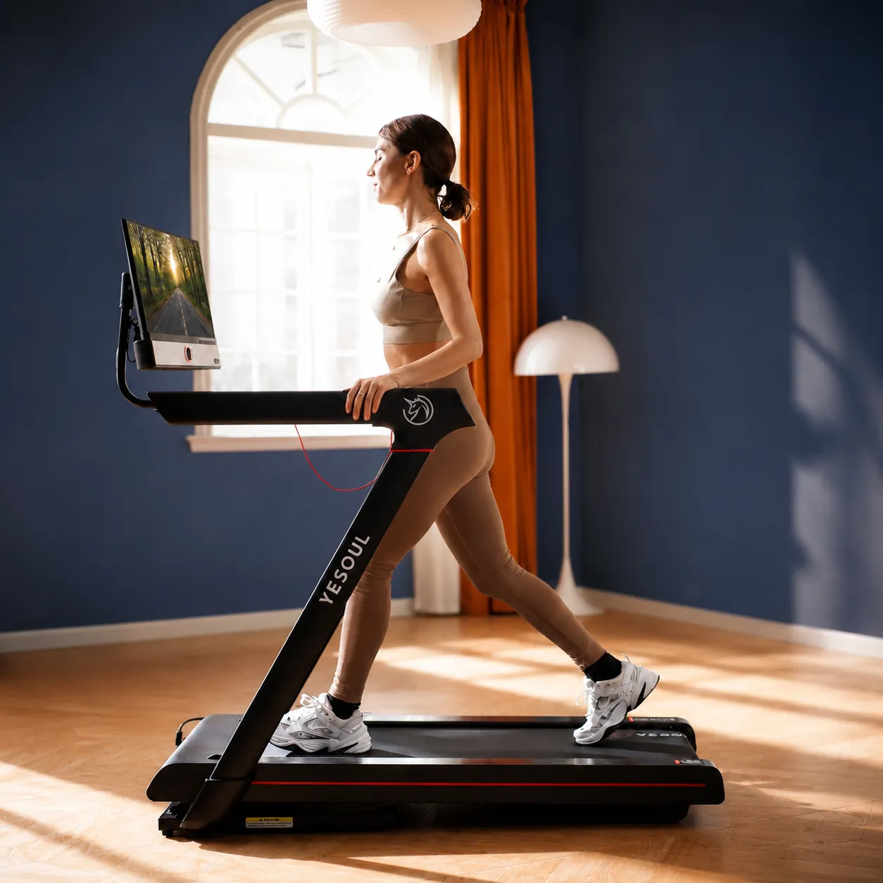 Woman walking on the Yesoul T3S Plus at home